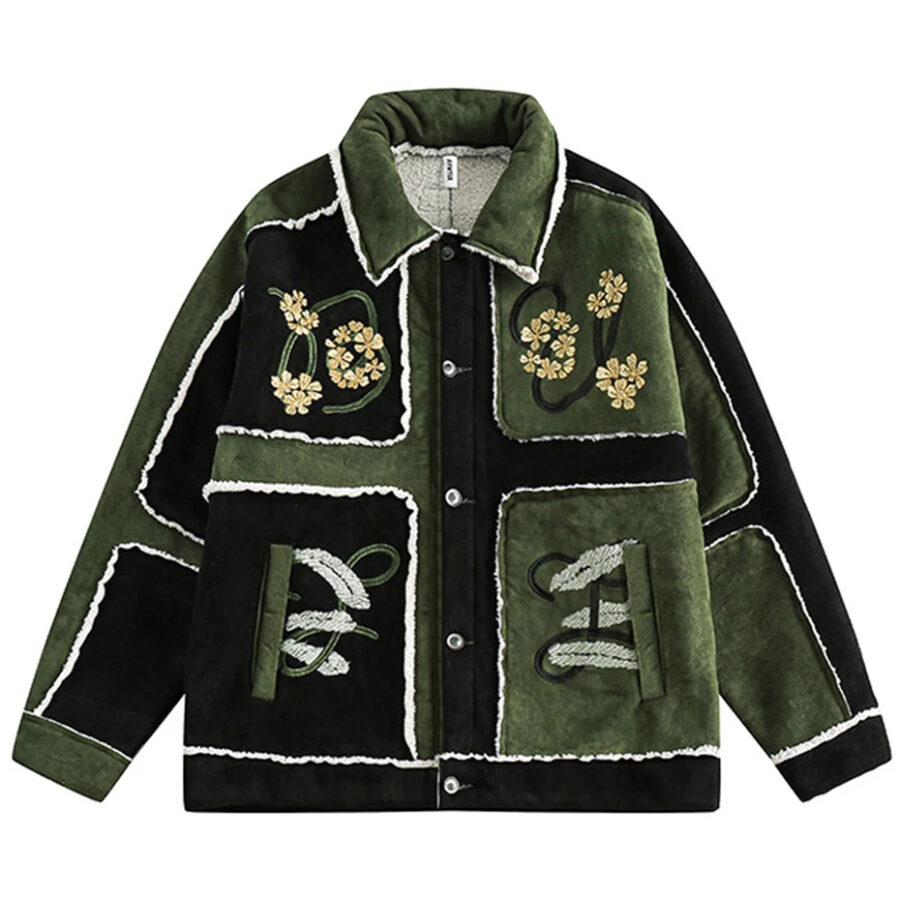 Veste style chanel homme avec col à revers et motifs brodés, de couleur vert et noir, sur un fond blanc.